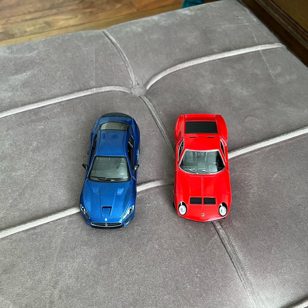 Maserati and Lamborghini model cars.